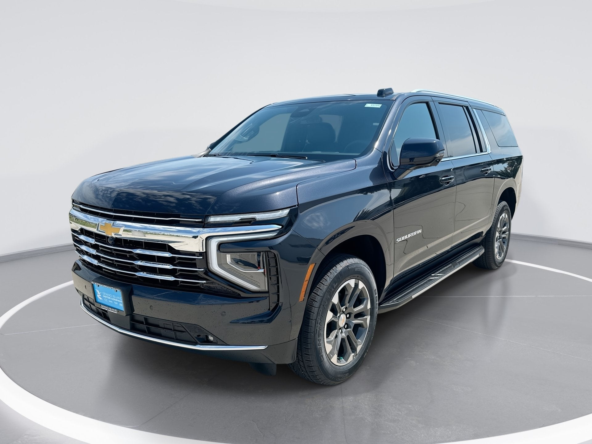 2026 Chevrolet Suburban LT in Dark Ash Metallic — front three-quarter view