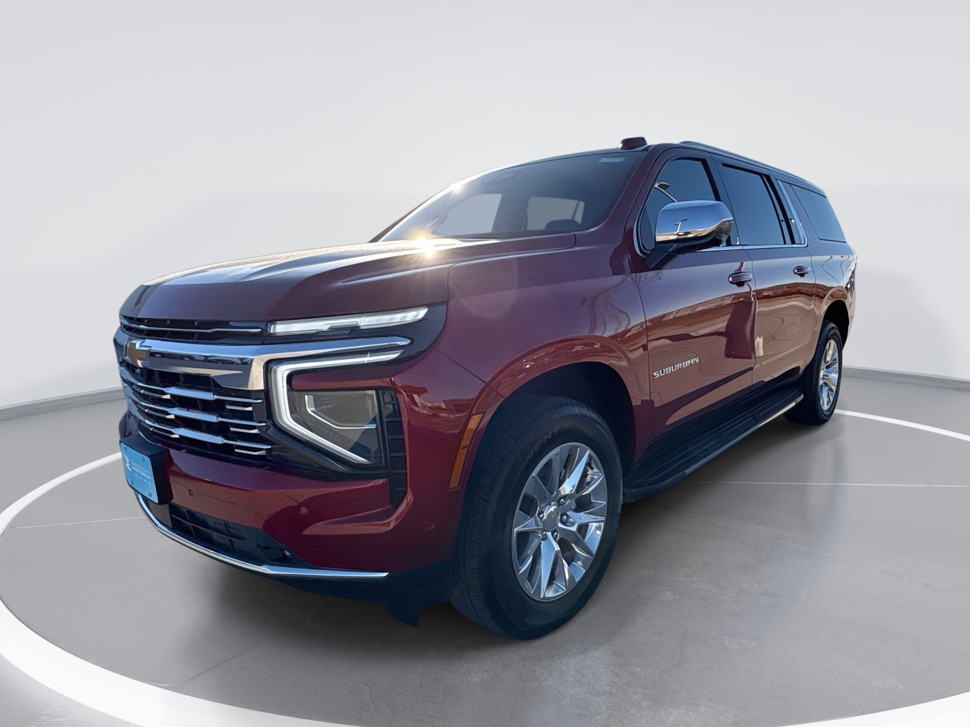 2026 Chevrolet Suburban Premier in Radiant Red Tintcoat — front three-quarter view