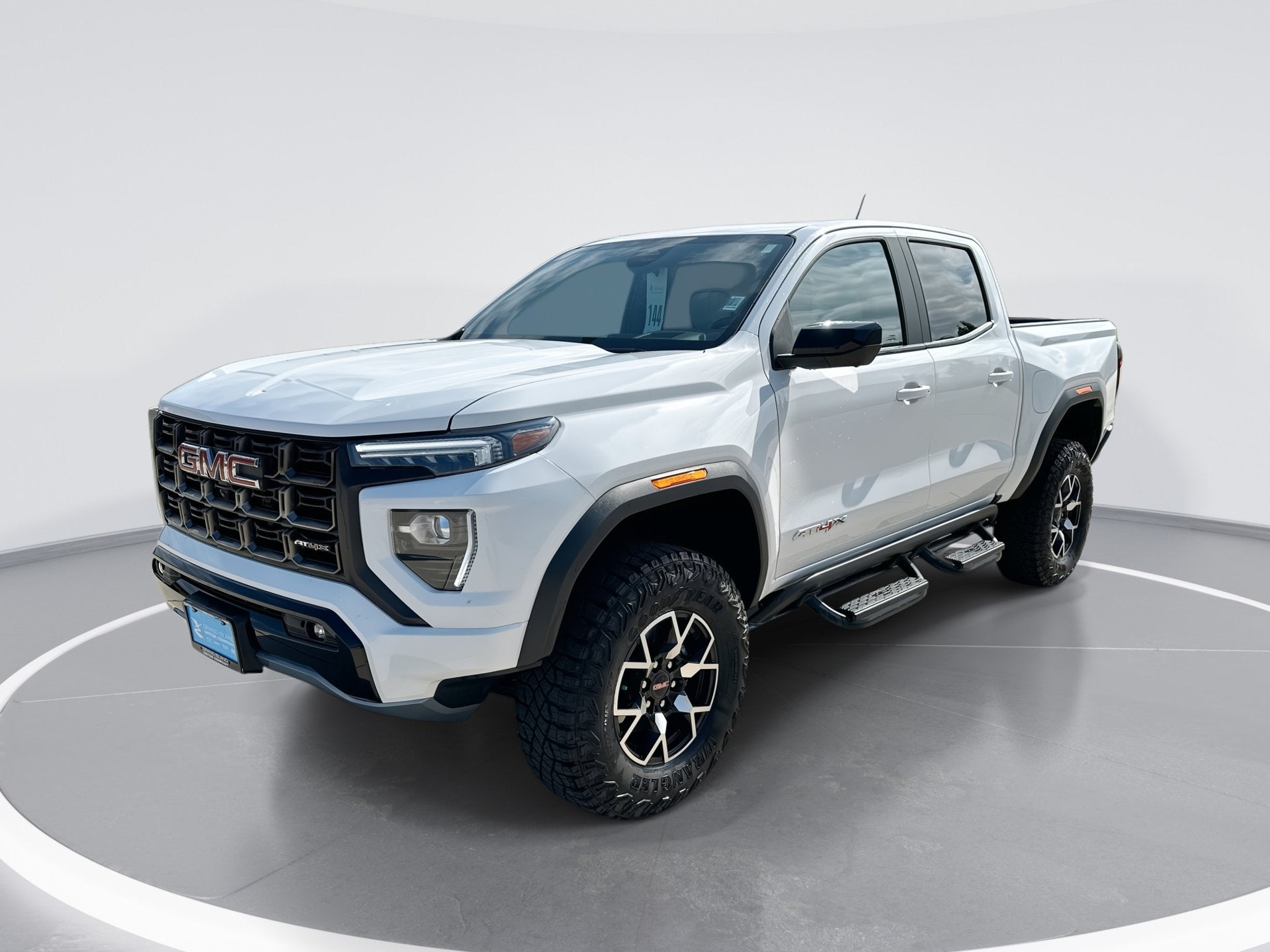 2024 GMC Canyon AT4X in Summit White — front three-quarter view