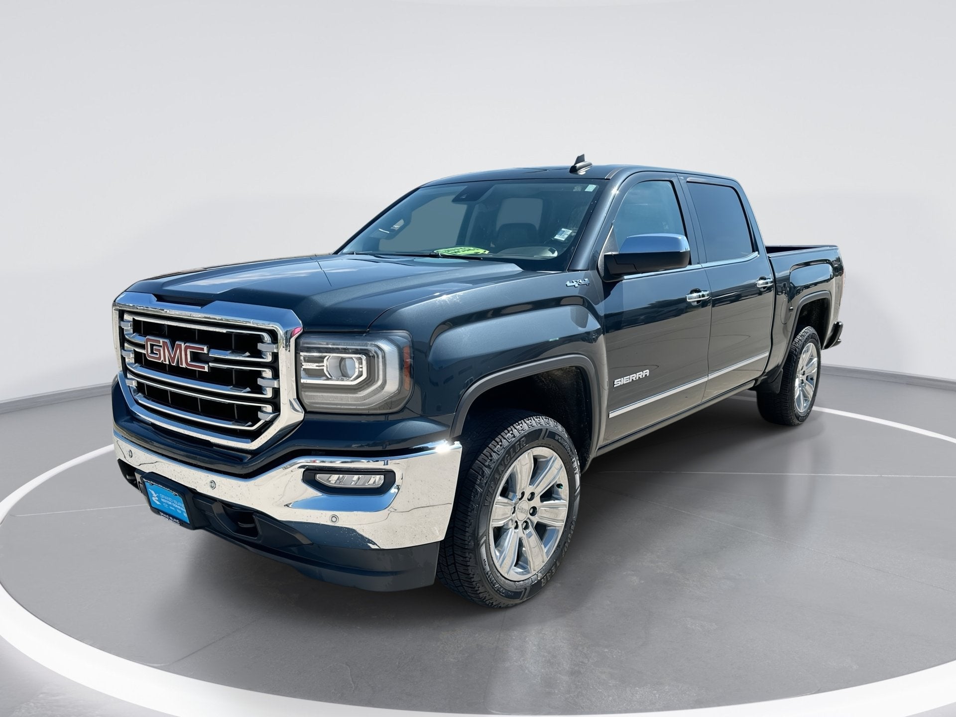 2017 GMC Sierra 1500 SLT in Dark Slate Metallic — front three-quarter view