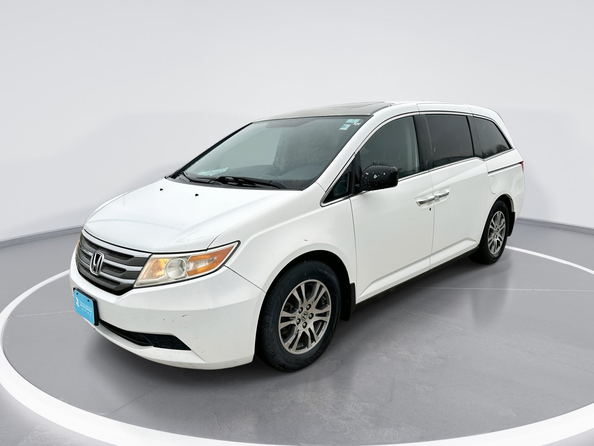 2013 Honda Odyssey EX-L in White — front three-quarter view