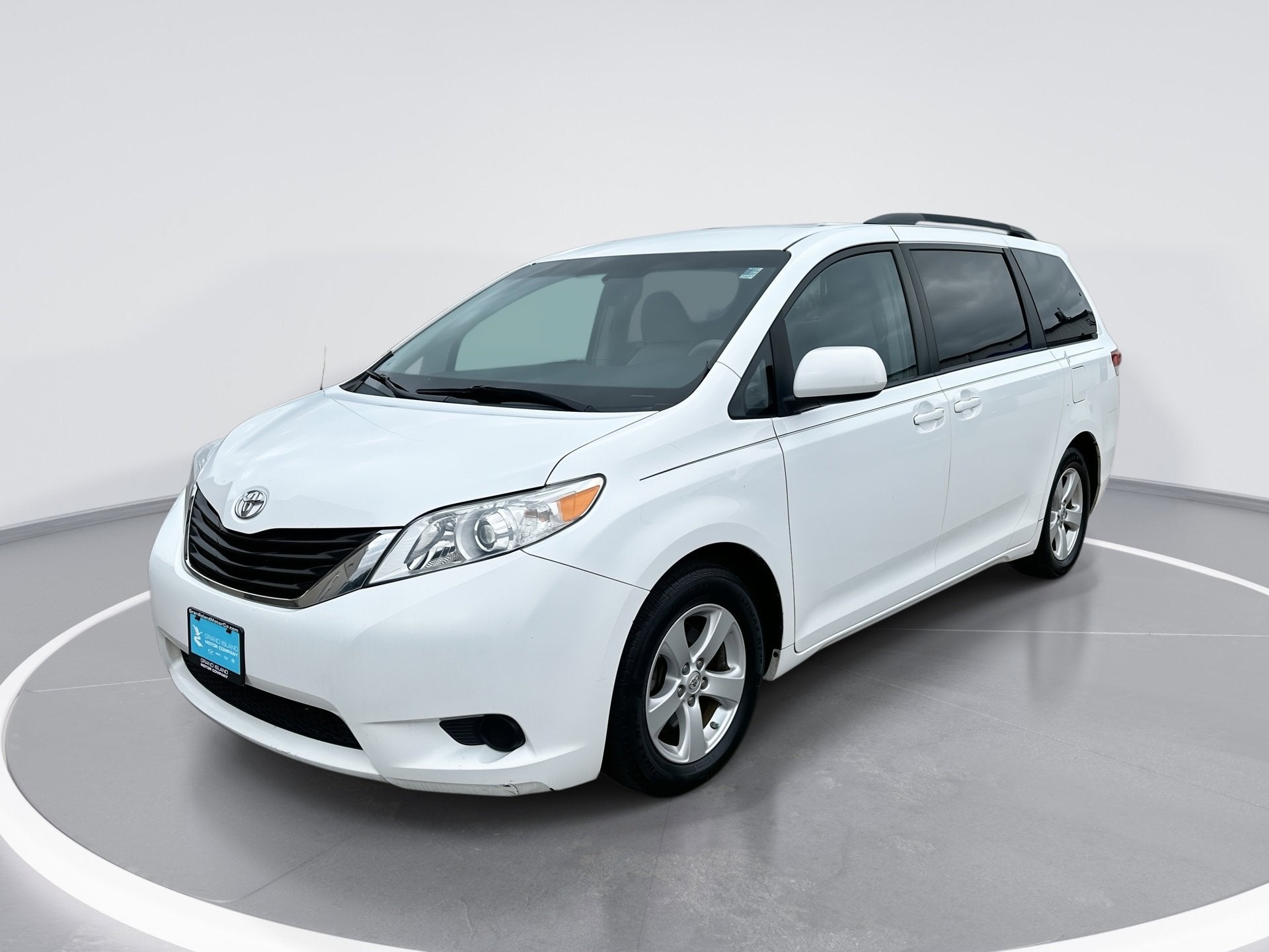 2013 Toyota Sienna LE AAS in Super White — front three-quarter view