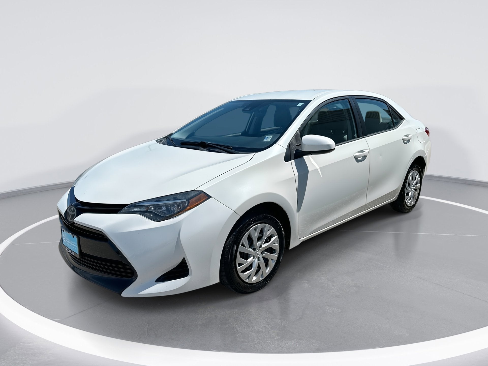 2017 Toyota Corolla L in Blizzard Pearl — front three-quarter view