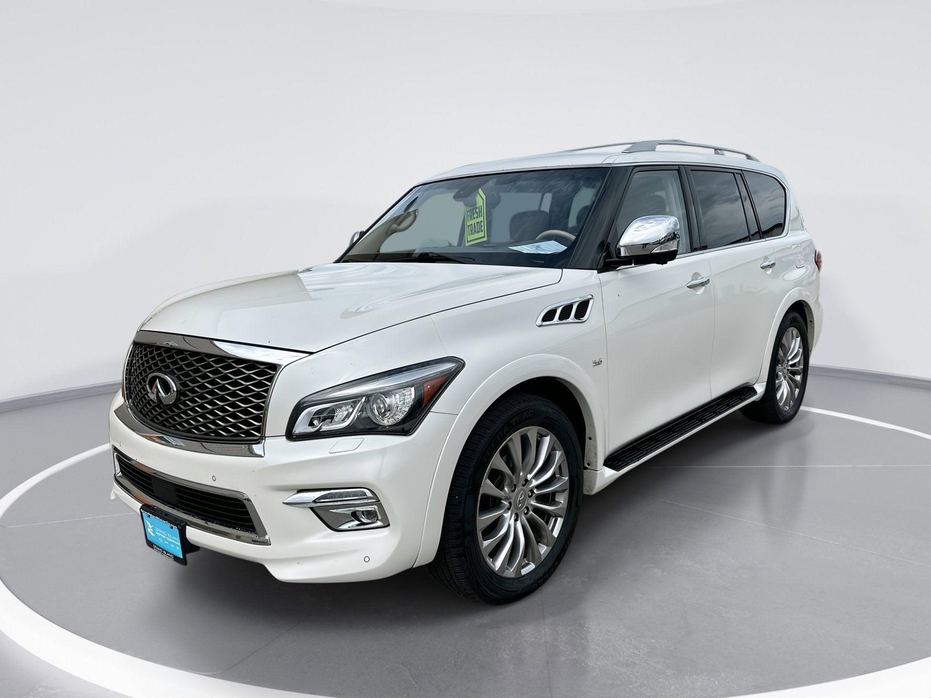 2016 INFINITI QX80 33 TURBO PREMIU in Majestic White — front three-quarter view